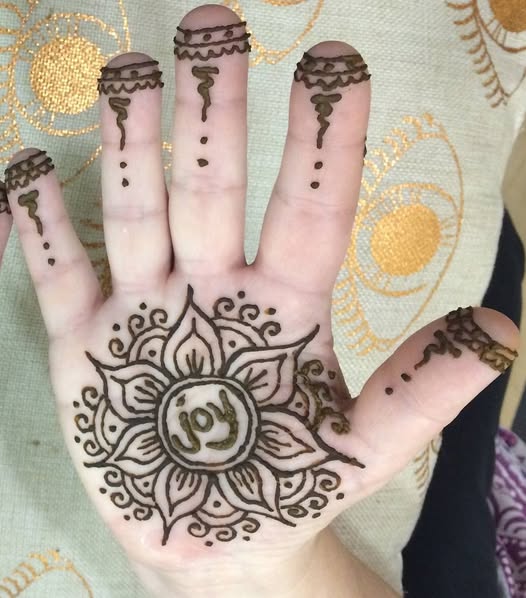 henna hand with the word JOY