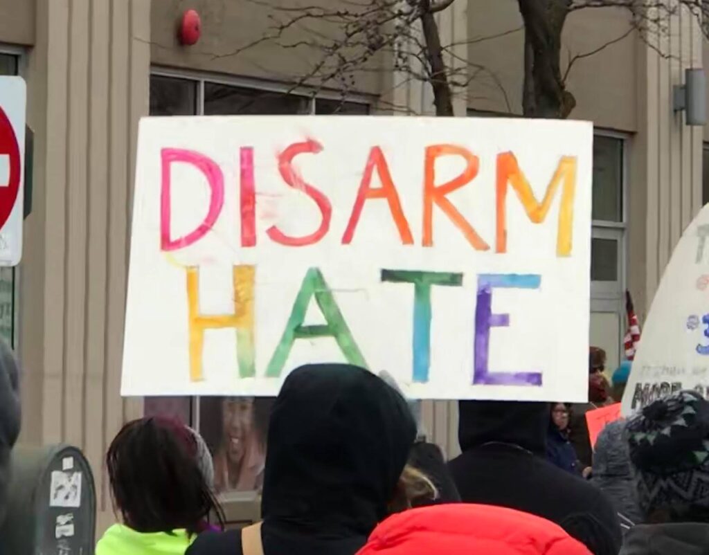 rainbow lettering that says DISARM HATE